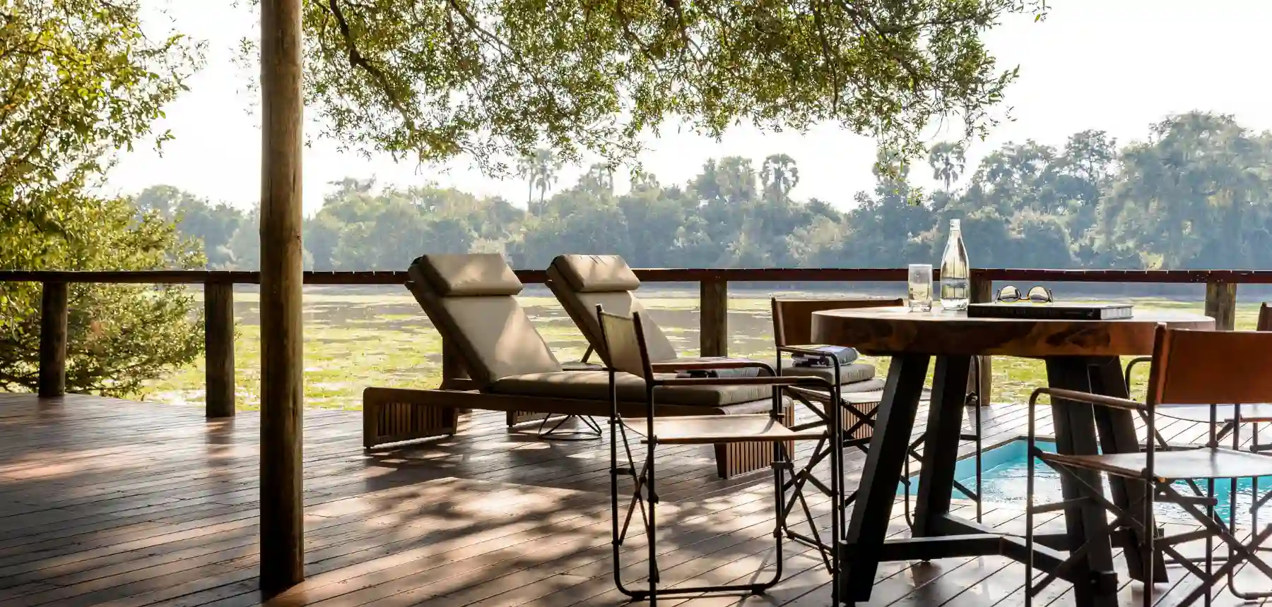 Private safari lodge deck with plunge pool and river views in Africa