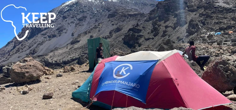 Tent camp on rocky terrain during a Mount Kilimanjaro climb