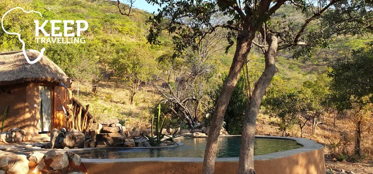 Swimming pool beside a thatched safari chalet at Hodi Hodi near Ruaha